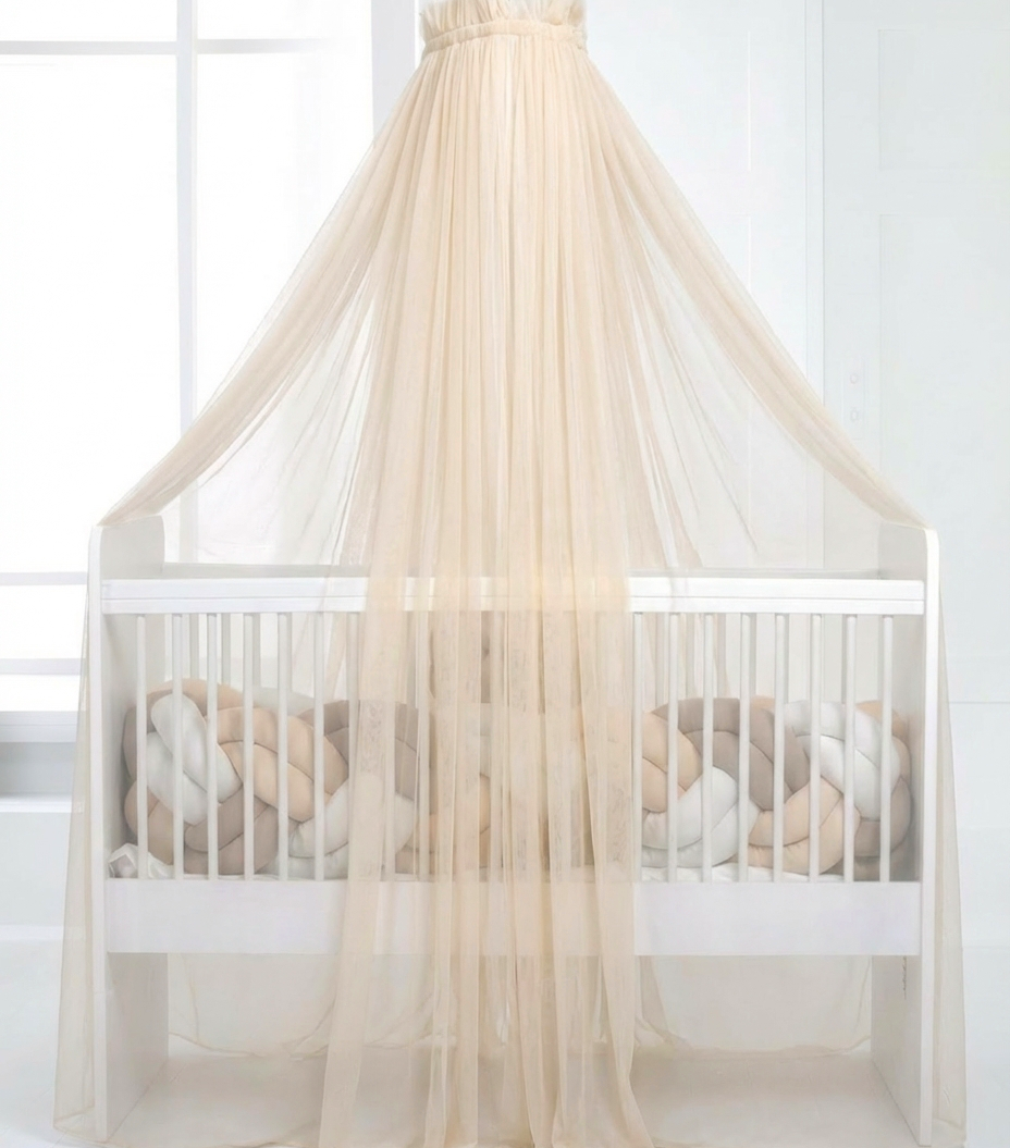 Light beige bed canopy with bobbles