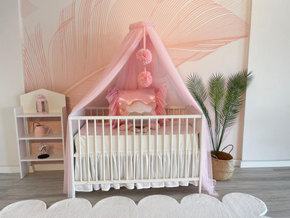 pink bed canopy with pompoms