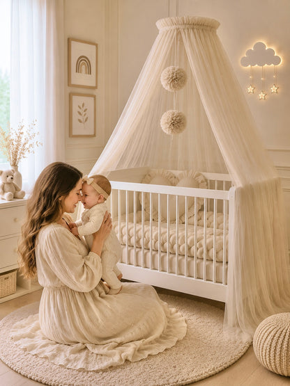 Beige bed canopy with pompoms