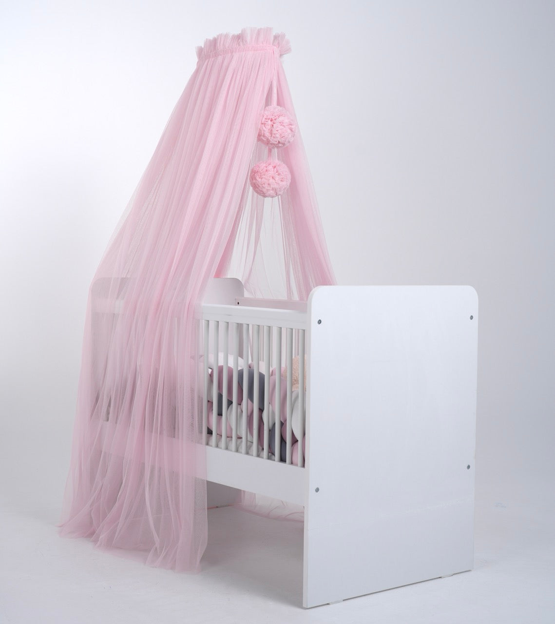 pink bed canopy with pompoms