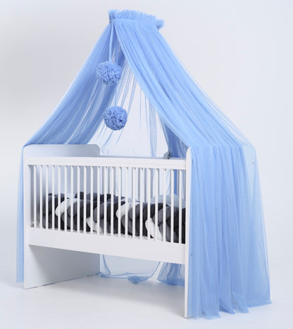 blue bed canopy with pompoms