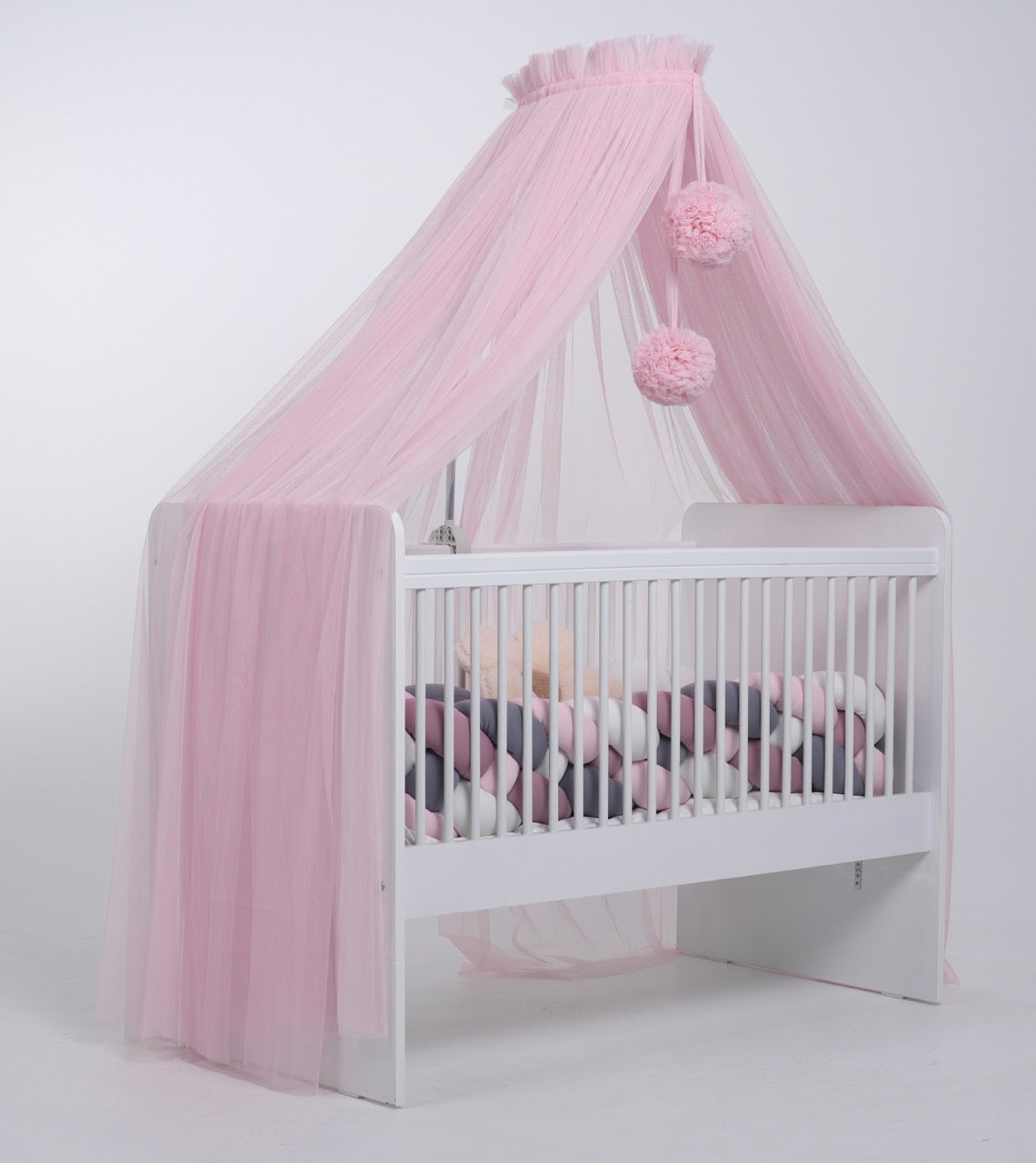 pink bed canopy with pompoms