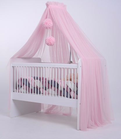 pink bed canopy with pompoms